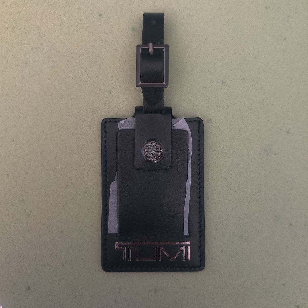 Brand new tumi luggage tag